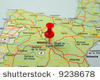 Red pin pointing on city in map